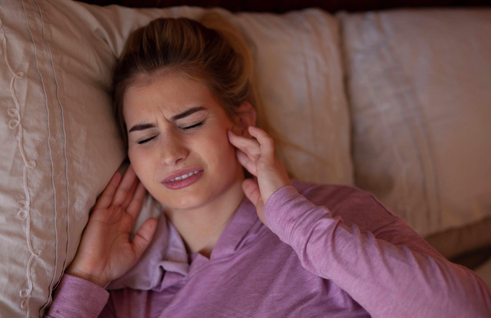 women sleeping in jaw discomfort