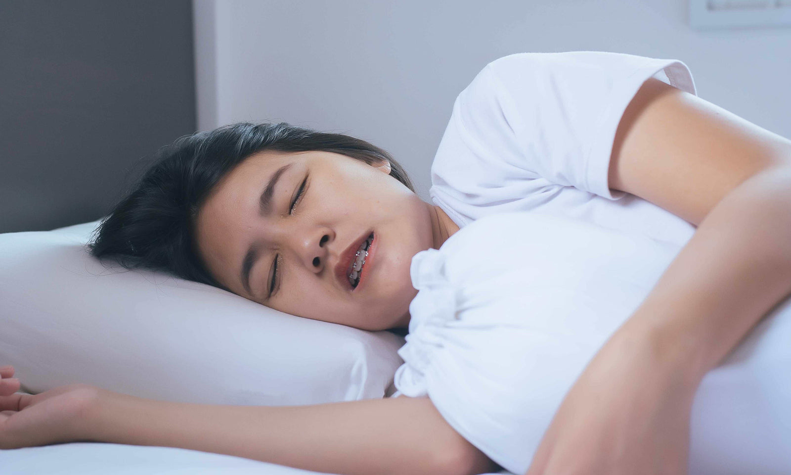 women side sleeping restlessly